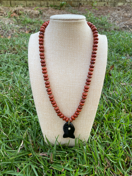 Natural red jasper bead with black fish charm