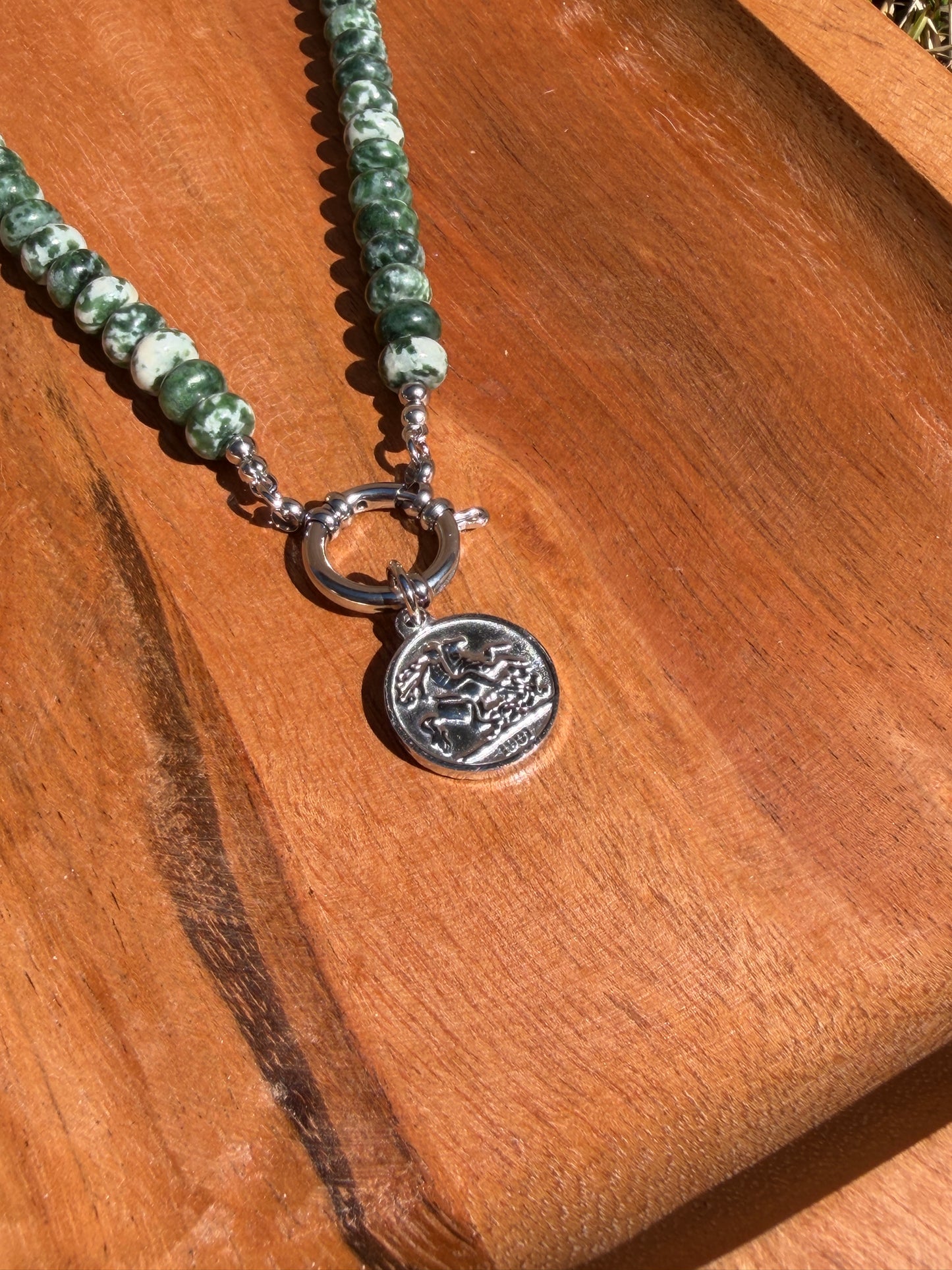 Green Rondelle with charm