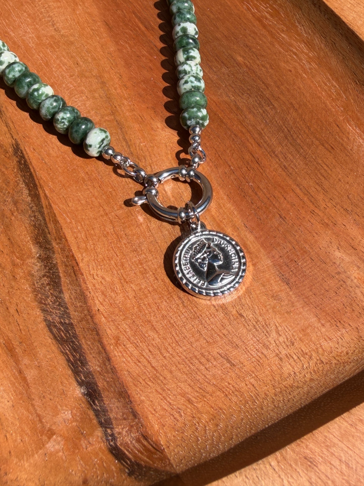 Green Rondelle with charm